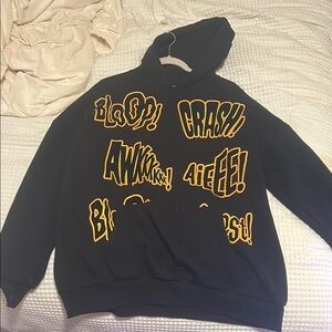 Black Hoodie with Vibrant Yellow Graphics